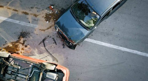 Elevated view of broken cars after accident.