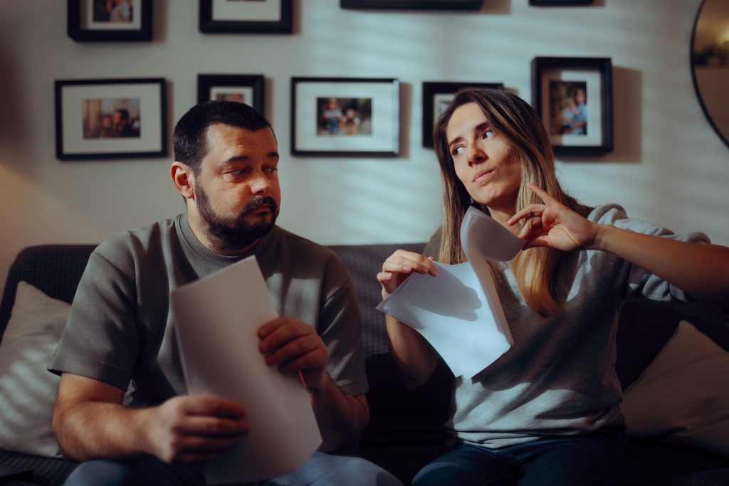 Wife Tearing Apart a Prenuptial Agreement or a Legal Document . Woman annulling a marriage contract by physically destroying the paperwork.